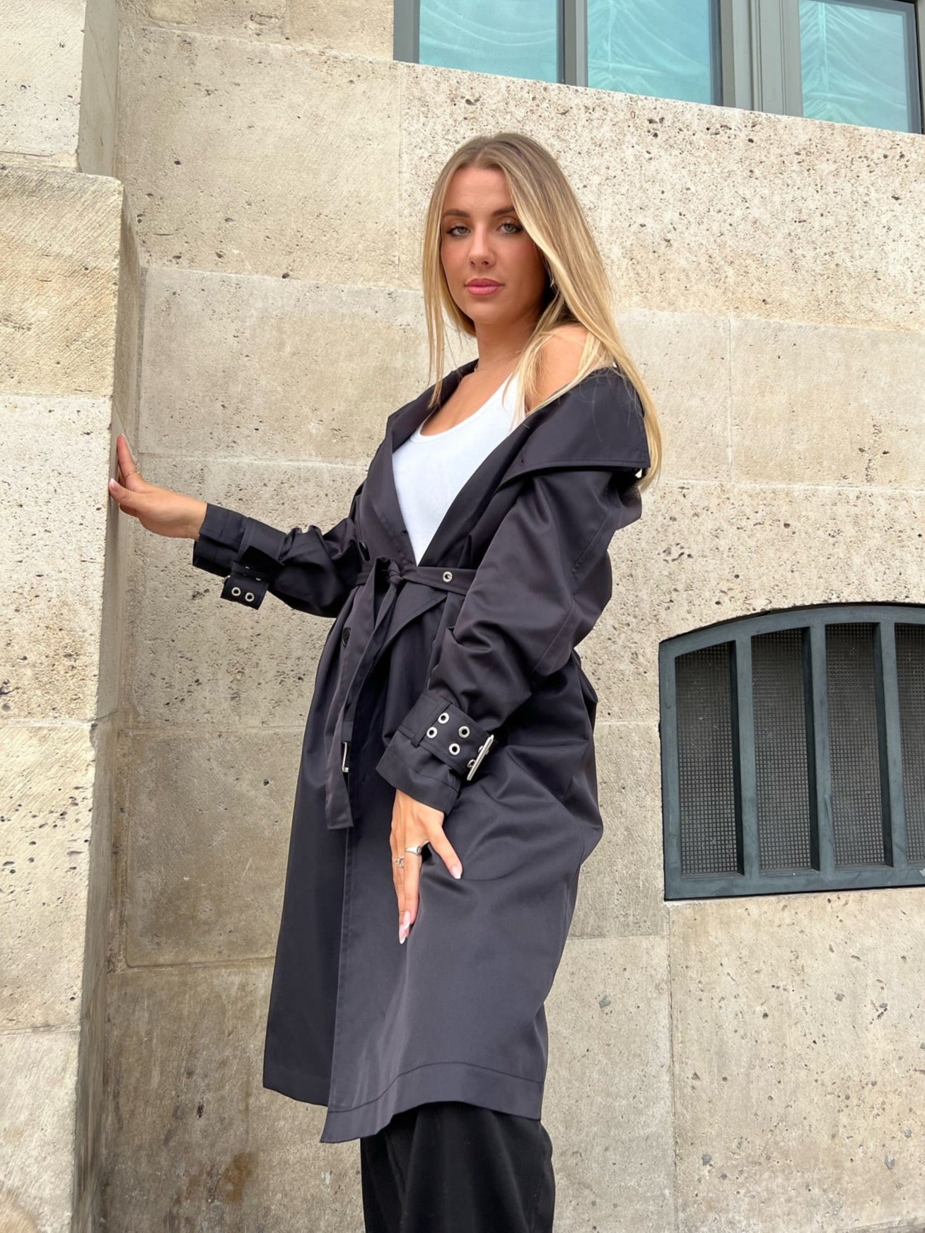 Trench coat with eyelet details